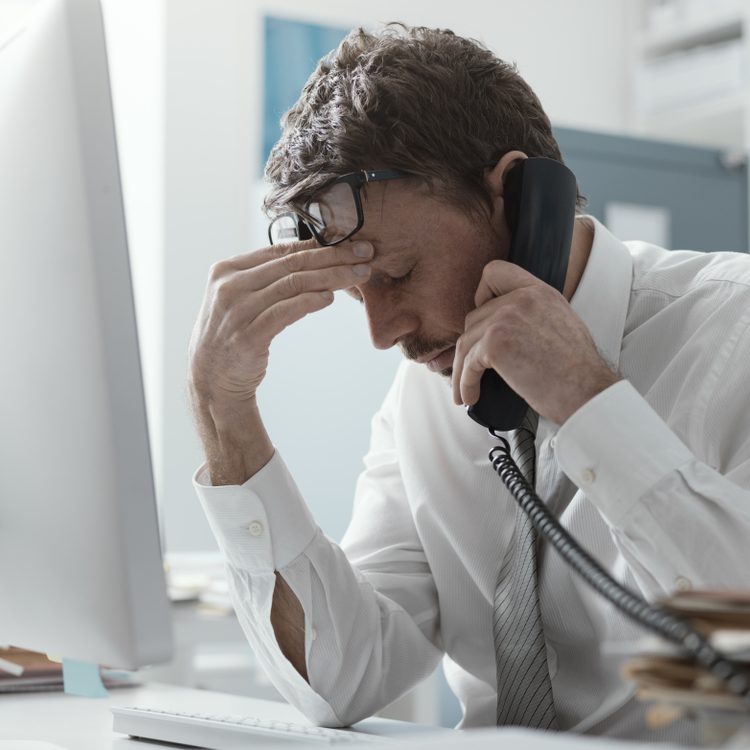 Business,Executive,Working,In,The,Office,And,Receiving,Bad,News