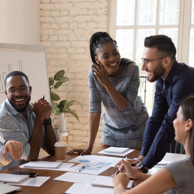 Happy,Friendly,Multiracial,Business,Team,Laughing,Working,Together,At,Corporate