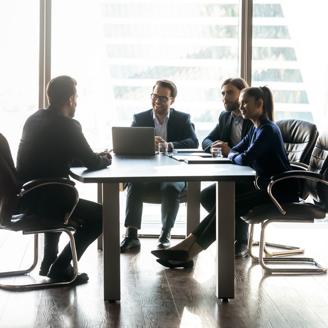 Happy,Diverse,Colleagues,Hr,Team,Sitting,At,Table,In,Front