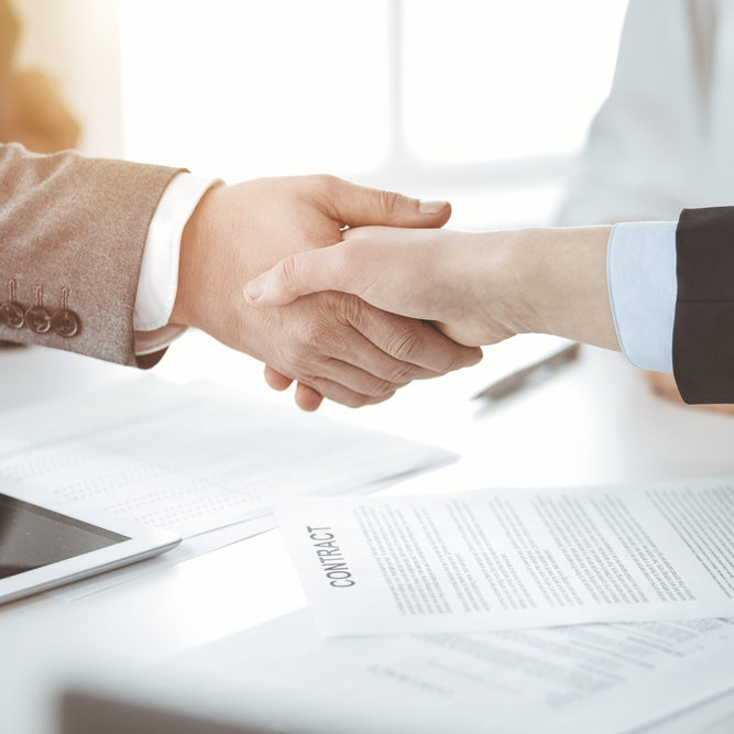 Business,People,Shaking,Hands,Finishing,Contract,Signing,In,Sunny,Office,