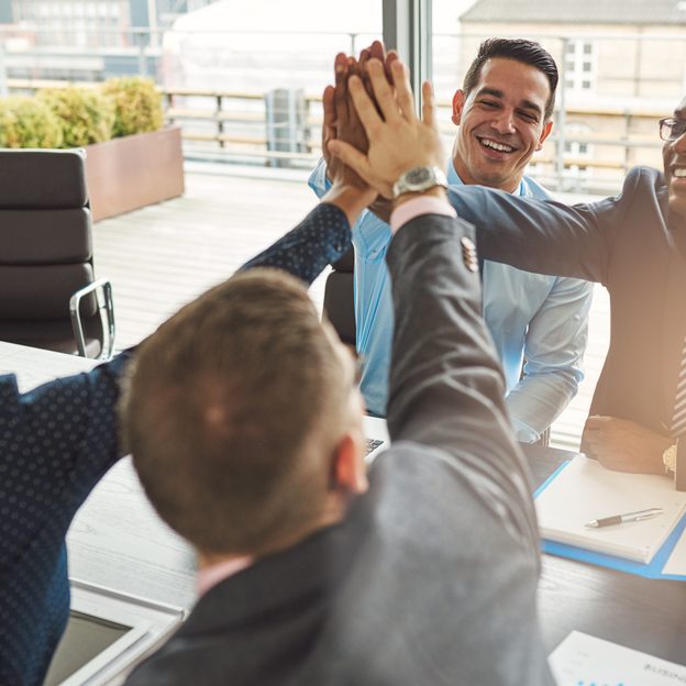 Exultant,Team,Of,Multiracial,Young,Business,Professionals,Rejoicing,And,Congratulating